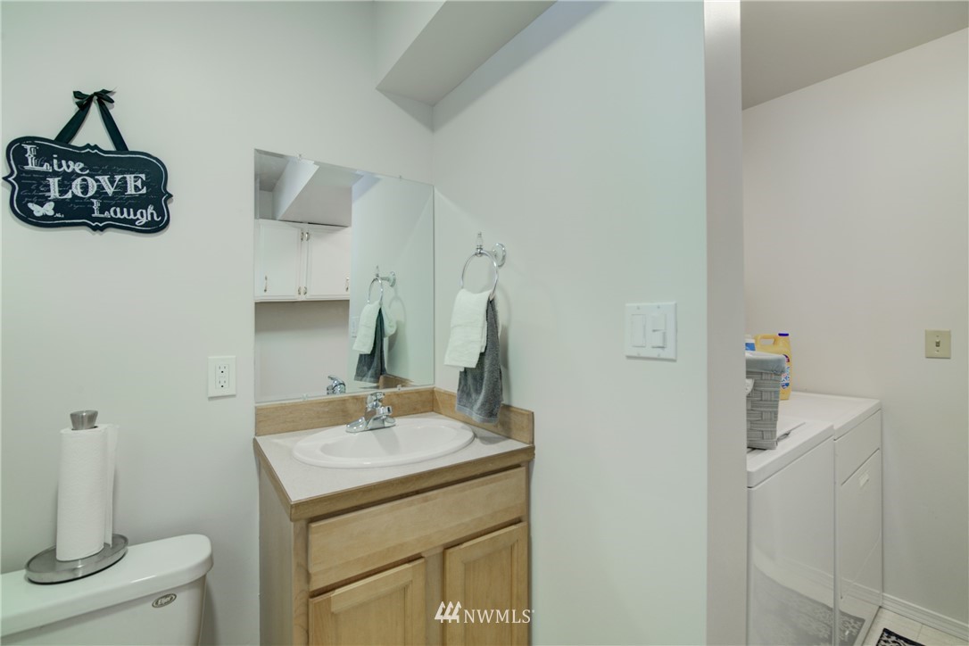 21930 3rd Place West Bothell, WA 98021 - Photo 27 of 34 a bathroom with a sink and a mirror