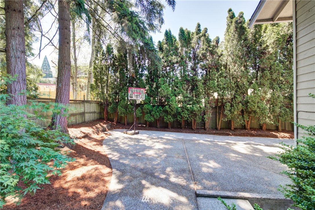 21930 3rd Place West Bothell, WA 98021 - Photo 33 of 34 a backyard of a house with lots of green space and fountain