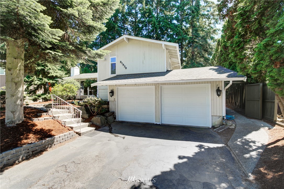 21930 3rd Place West Bothell, WA 98021 - Photo 34 of 34 a view of a house with a yard and large trees
