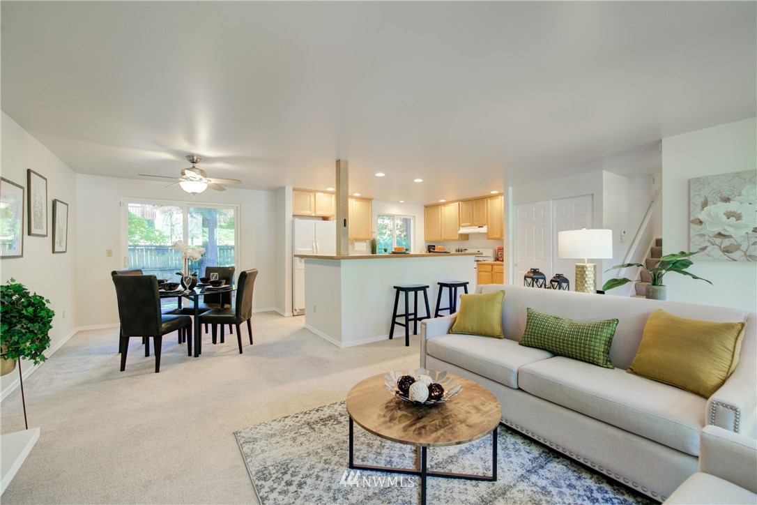 21930 3rd Place West Bothell, WA 98021 - Photo 5 of 34 a living room with furniture and a dining table with kitchen view
