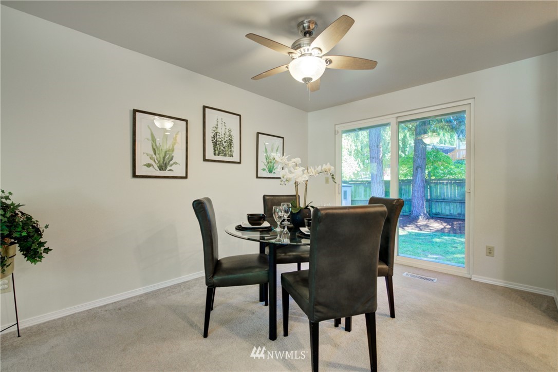 21930 3rd Place West Bothell, WA 98021 - Photo 10 of 34 a view of a dining room with furniture window and outside view