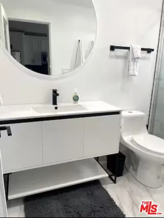 a bathroom with a toilet and a sink