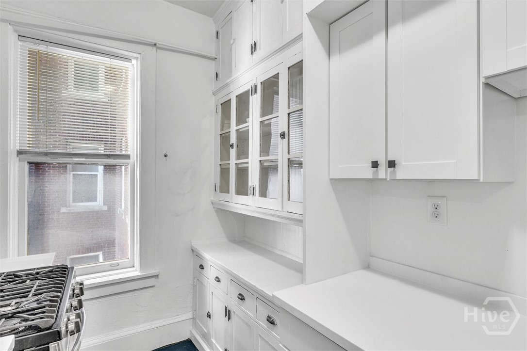 24 East Liberty, Unit 42 Savannah, GA 31401 - Photo 22 of 44 Original built-in cupboard adds charm to the kitchen as well as storage