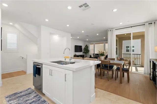 a view of kitchen with cabinets and wooden floor