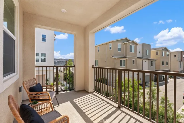 a view of a balcony with wooden floor