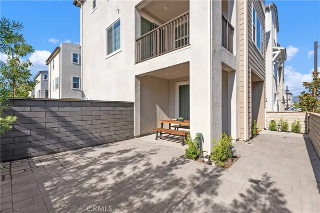 a pathway of a house with a yard
