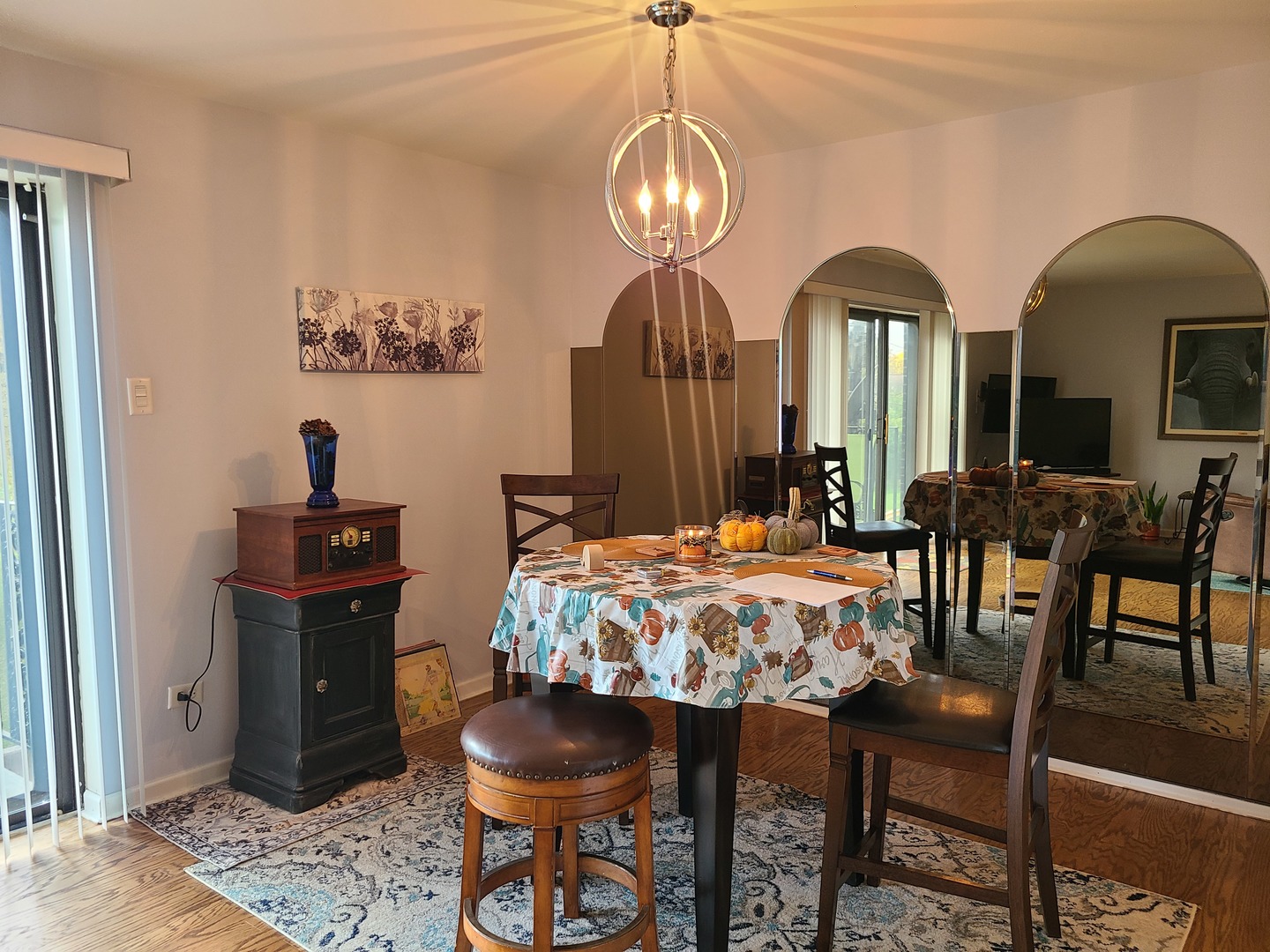 8359 West Addison Street, Unit 201 Chicago, IL 60634 - Photo 12 of 22 a view of a dining room with furniture and chandelier