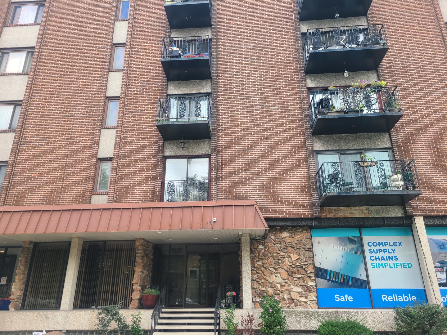 8359 West Addison Street, Unit 201 Chicago, IL 60634 - Photo 2 of 22 a view of a building with car windows