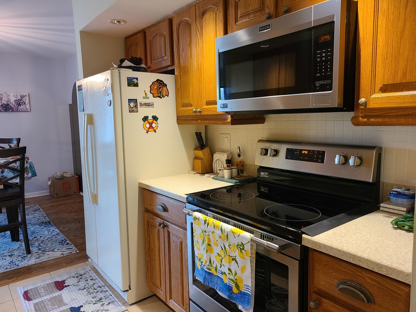 8359 West Addison Street, Unit 201 Chicago, IL 60634 - Photo 8 of 22 a kitchen with stainless steel appliances granite countertop a stove and a refrigerator