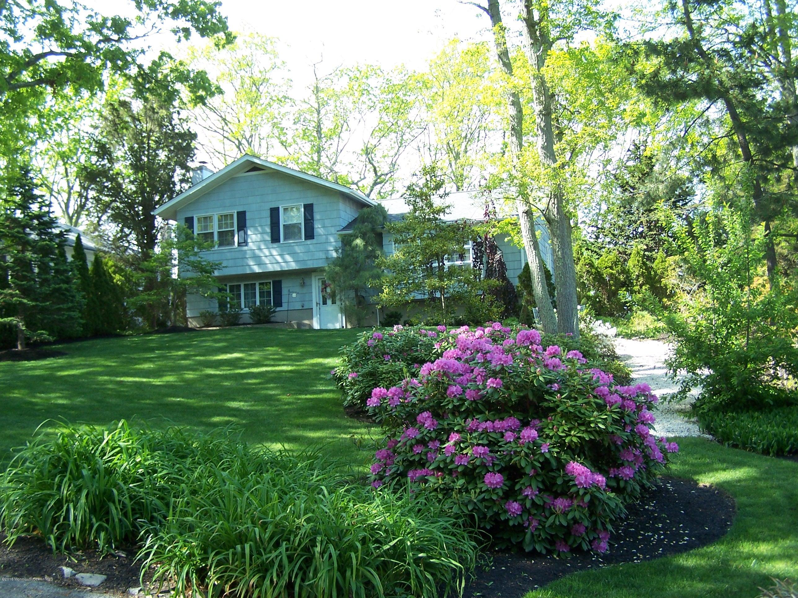 1210 Ivy Road Manasquan, NJ 08736 - Photo 1 of 25 a front view of a house with a yard
