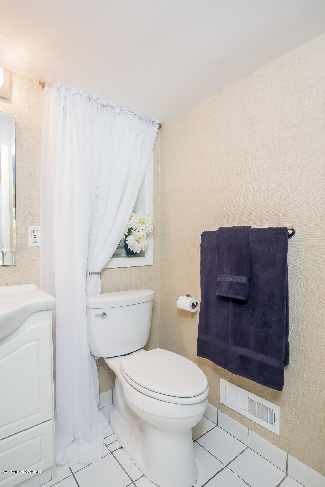 1210 Ivy Road Manasquan, NJ 08736 - Photo 22 of 25 a bathroom with a toilet a sink and a shower