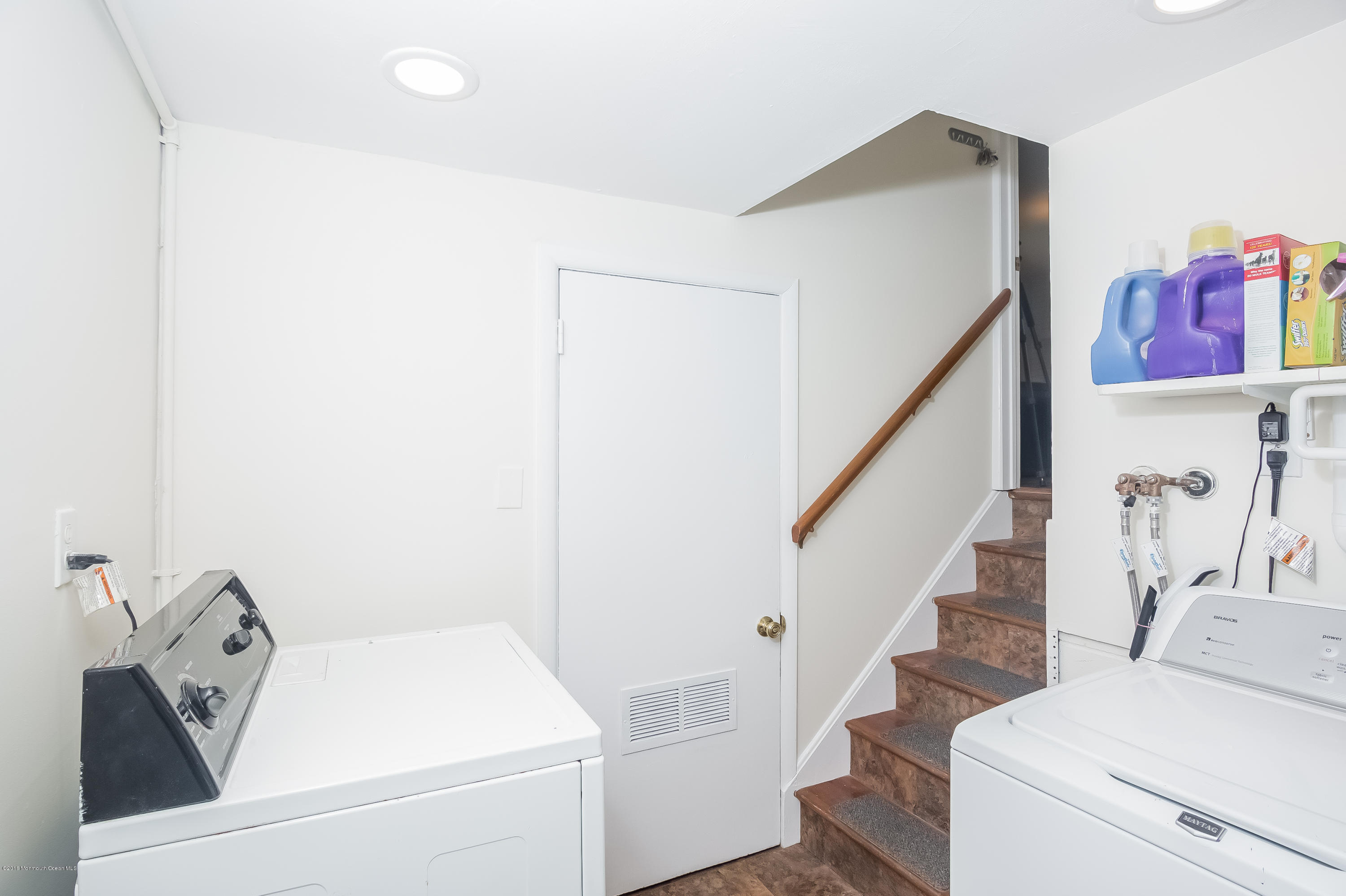1210 Ivy Road Manasquan, NJ 08736 - Photo 23 of 25 a bathroom with a sink and a mirror