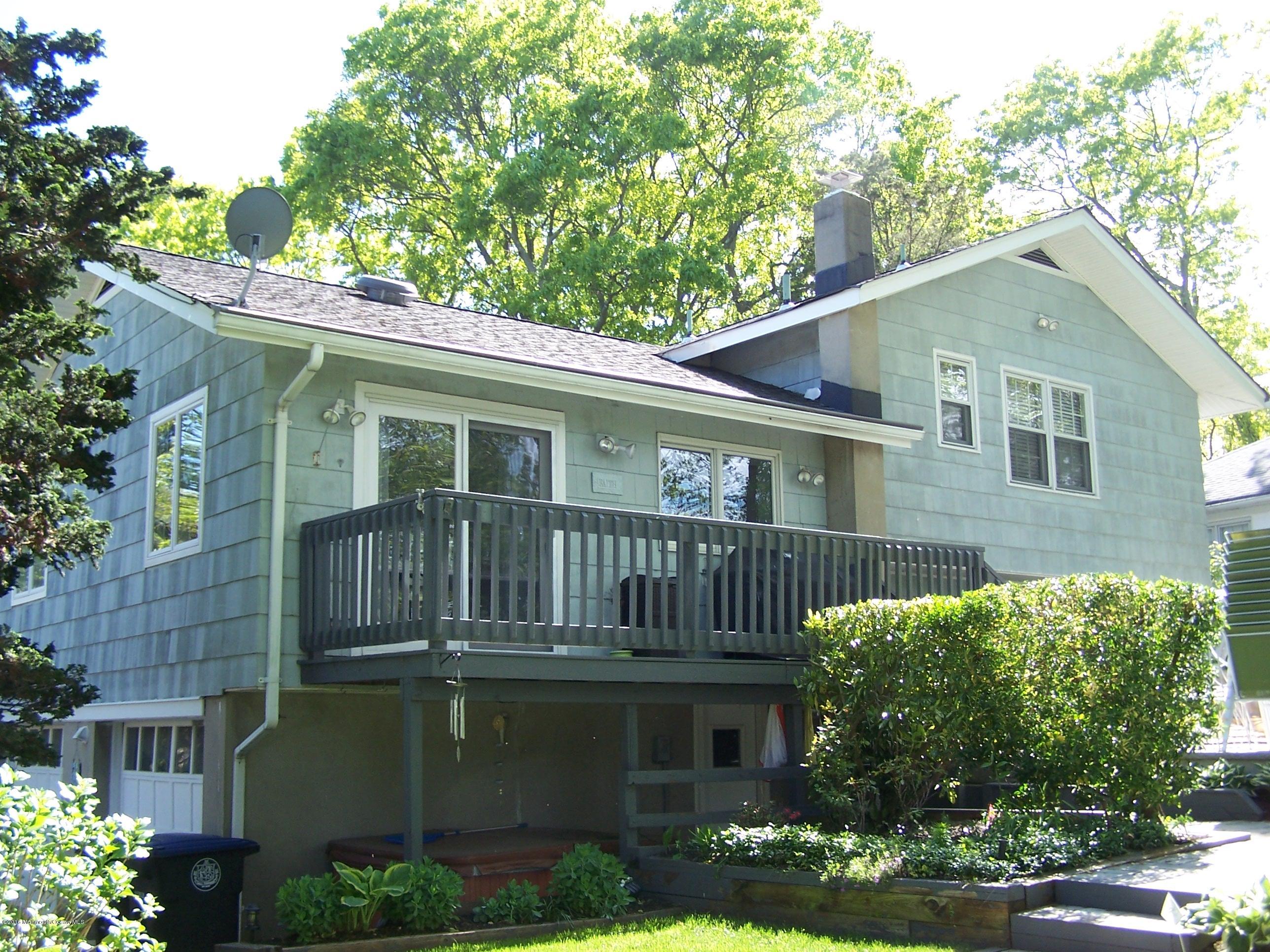 1210 Ivy Road Manasquan, NJ 08736 - Photo 4 of 25 a front view of a house with garden