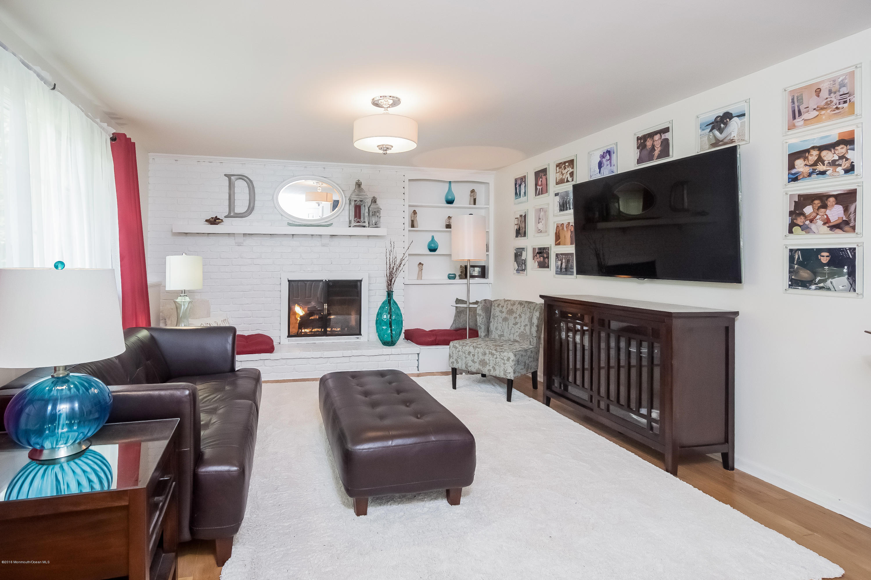 1210 Ivy Road Manasquan, NJ 08736 - Photo 9 of 25 a living room with furniture and a flat screen tv