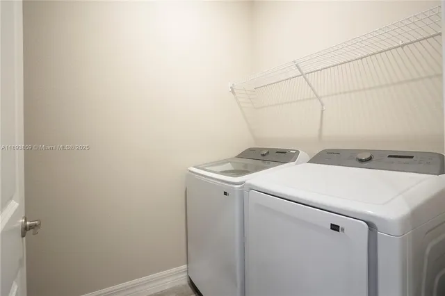 a utility room with dryer and washer