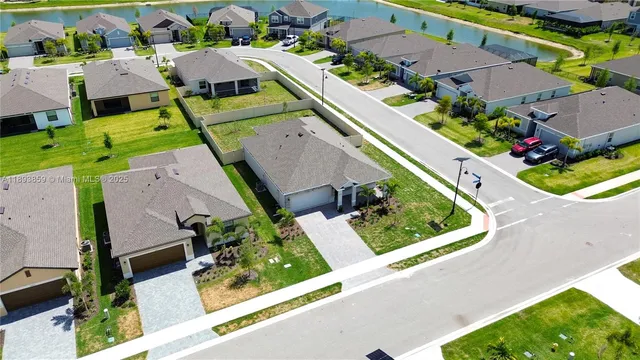 an aerial view of multiple houses with yard