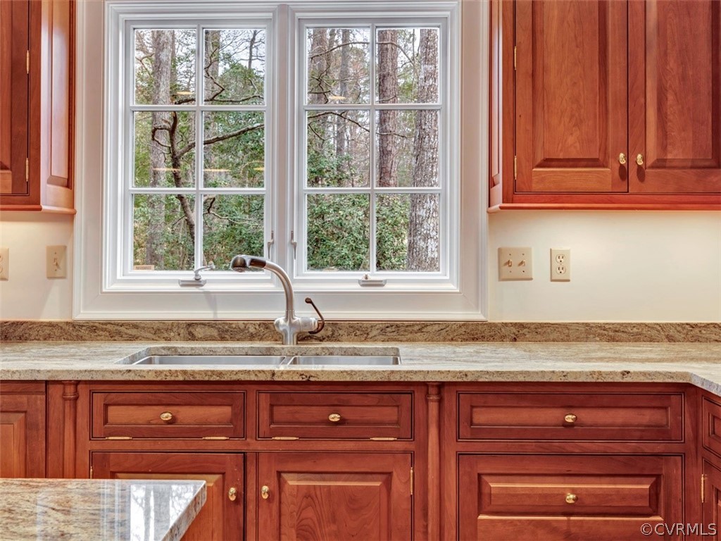 3900 Timber Ridge Road Midlothian, VA 23112 - Photo 11 of 44 a kitchen with granite countertop wooden cabinets and a window