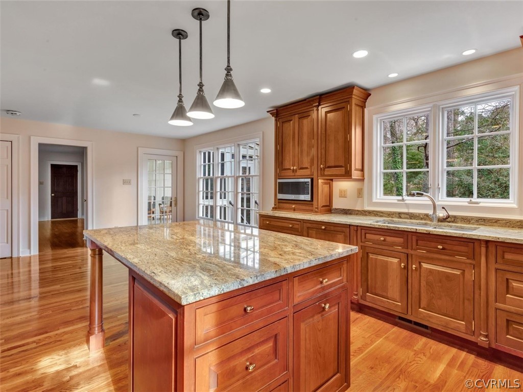 3900 Timber Ridge Road Midlothian, VA 23112 - Photo 12 of 44 a kitchen with stainless steel appliances granite countertop wooden cabinets a center island and a window