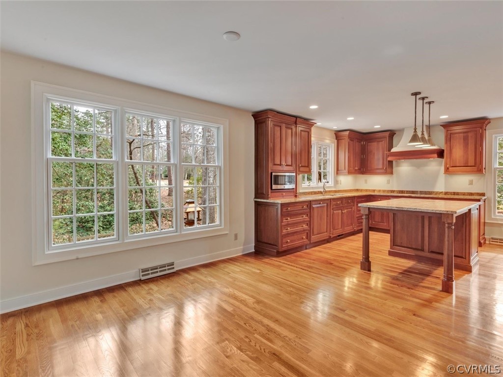 3900 Timber Ridge Road Midlothian, VA 23112 - Photo 13 of 44 a large kitchen with kitchen island a large window a sink and counter space