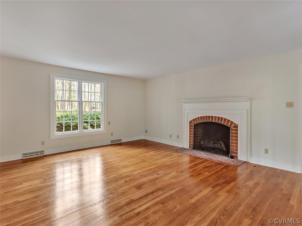 3900 Timber Ridge Road Midlothian, VA 23112 - Photo 14 of 44 a view of empty room with wooden floor and a window