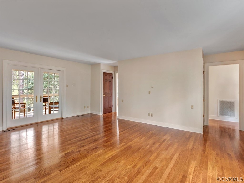 3900 Timber Ridge Road Midlothian, VA 23112 - Photo 15 of 44 a view of an empty room with wooden floor and a window