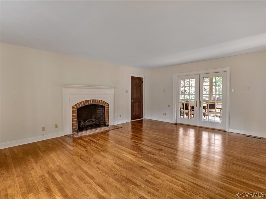3900 Timber Ridge Road Midlothian, VA 23112 - Photo 16 of 44 a view of empty room with wooden floor and fireplace