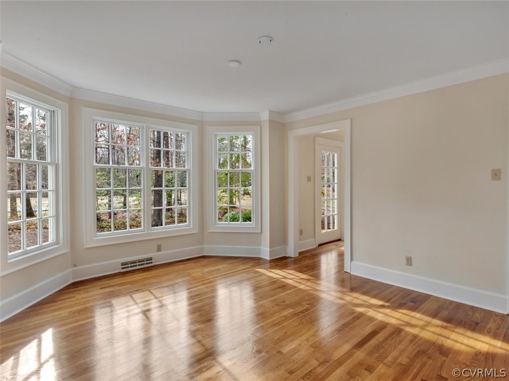 3900 Timber Ridge Road Midlothian, VA 23112 - Photo 20 of 44 a view of an empty room with wooden floor and a window