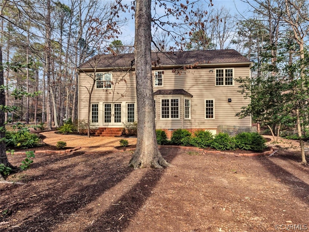 3900 Timber Ridge Road Midlothian, VA 23112 - Photo 4 of 44 a front view of a house with a yard and potted plants