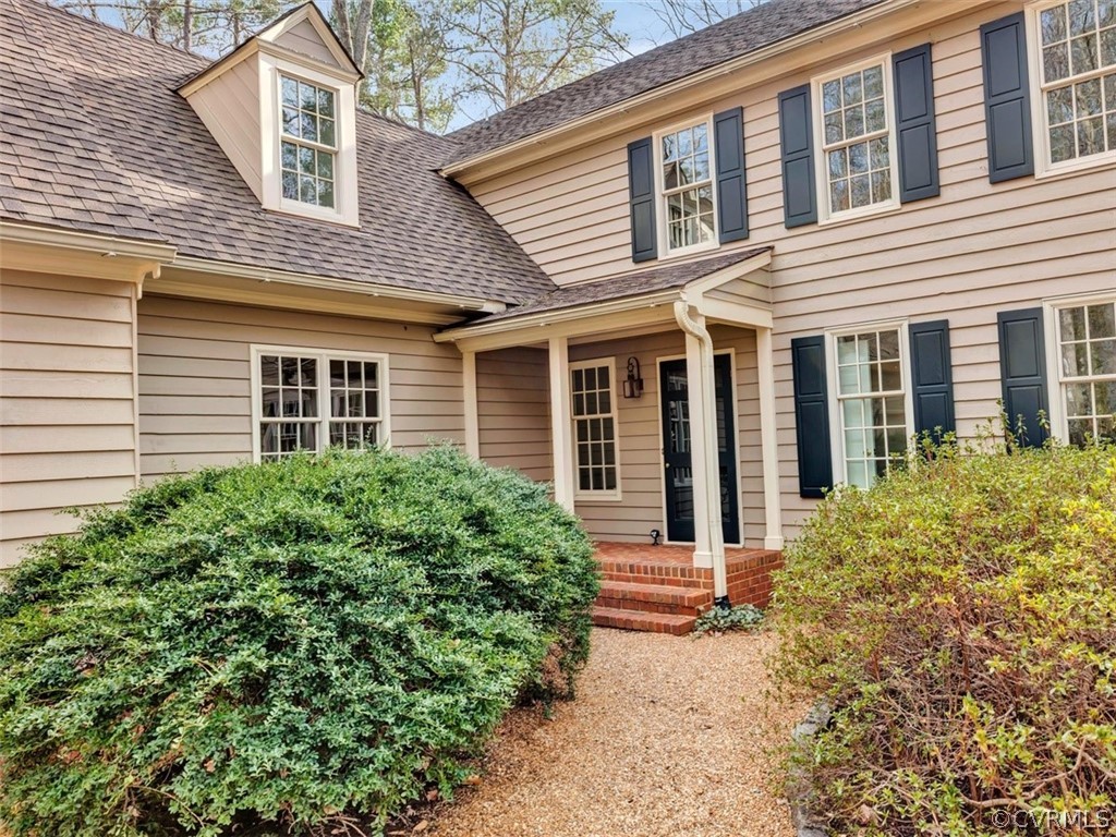 3900 Timber Ridge Road Midlothian, VA 23112 - Photo 6 of 44 a front view of a house with garden
