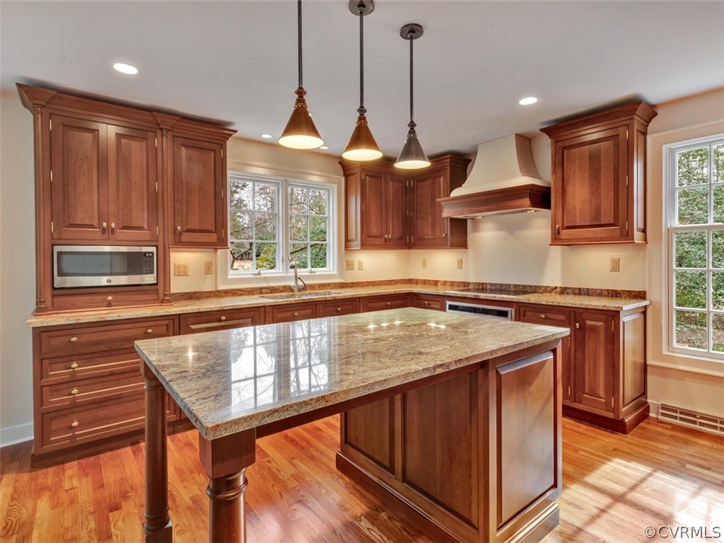 3900 Timber Ridge Road Midlothian, VA 23112 - Photo 8 of 44 a kitchen with stainless steel appliances granite countertop wooden cabinets stove and a sink