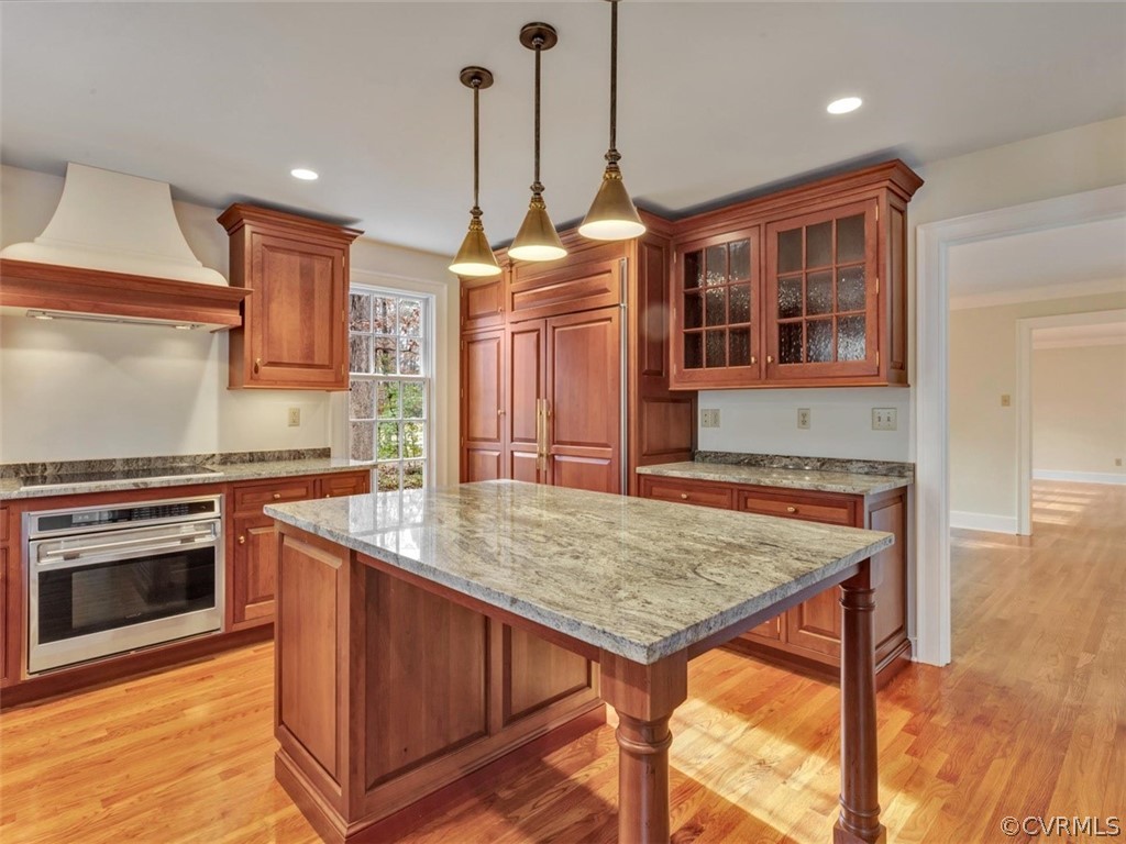 3900 Timber Ridge Road Midlothian, VA 23112 - Photo 9 of 44 a kitchen with a stove a sink and a wooden floor