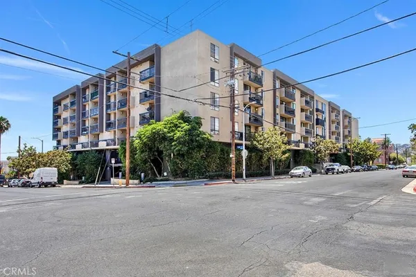 a view of a tall building with a street