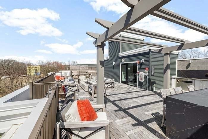 200 Revere Street, Unit 4209 Canton, MA 02021 - Photo 32 of 35 a view of a balcony dining area and furniture