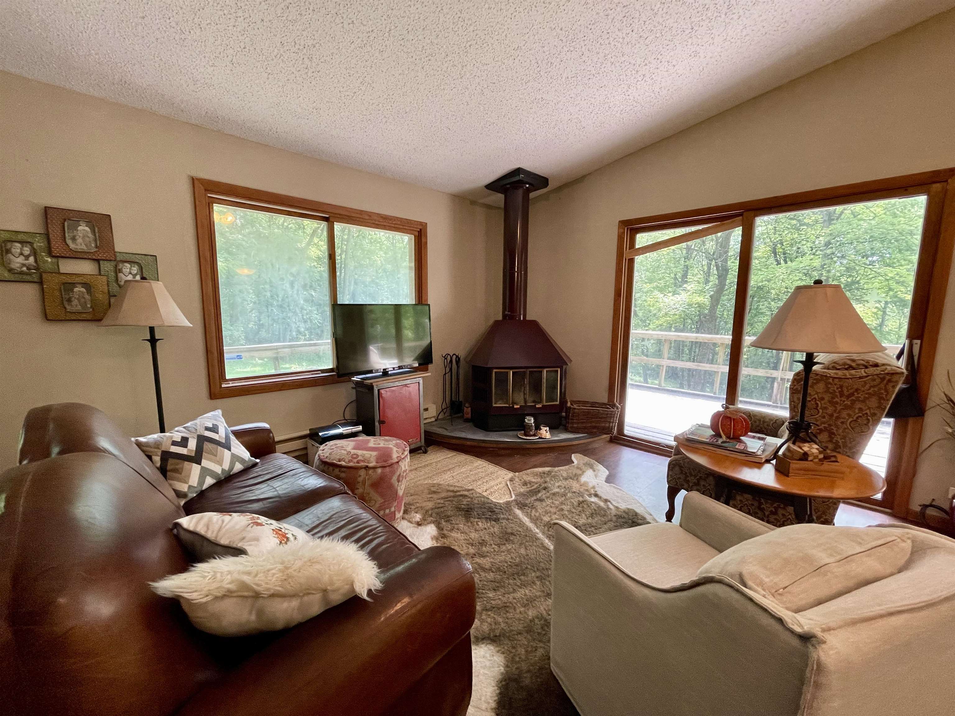 8008 West Blanding Road Hanover, IL 61041 - Photo 23 of 67 a living room with furniture and a floor to ceiling window