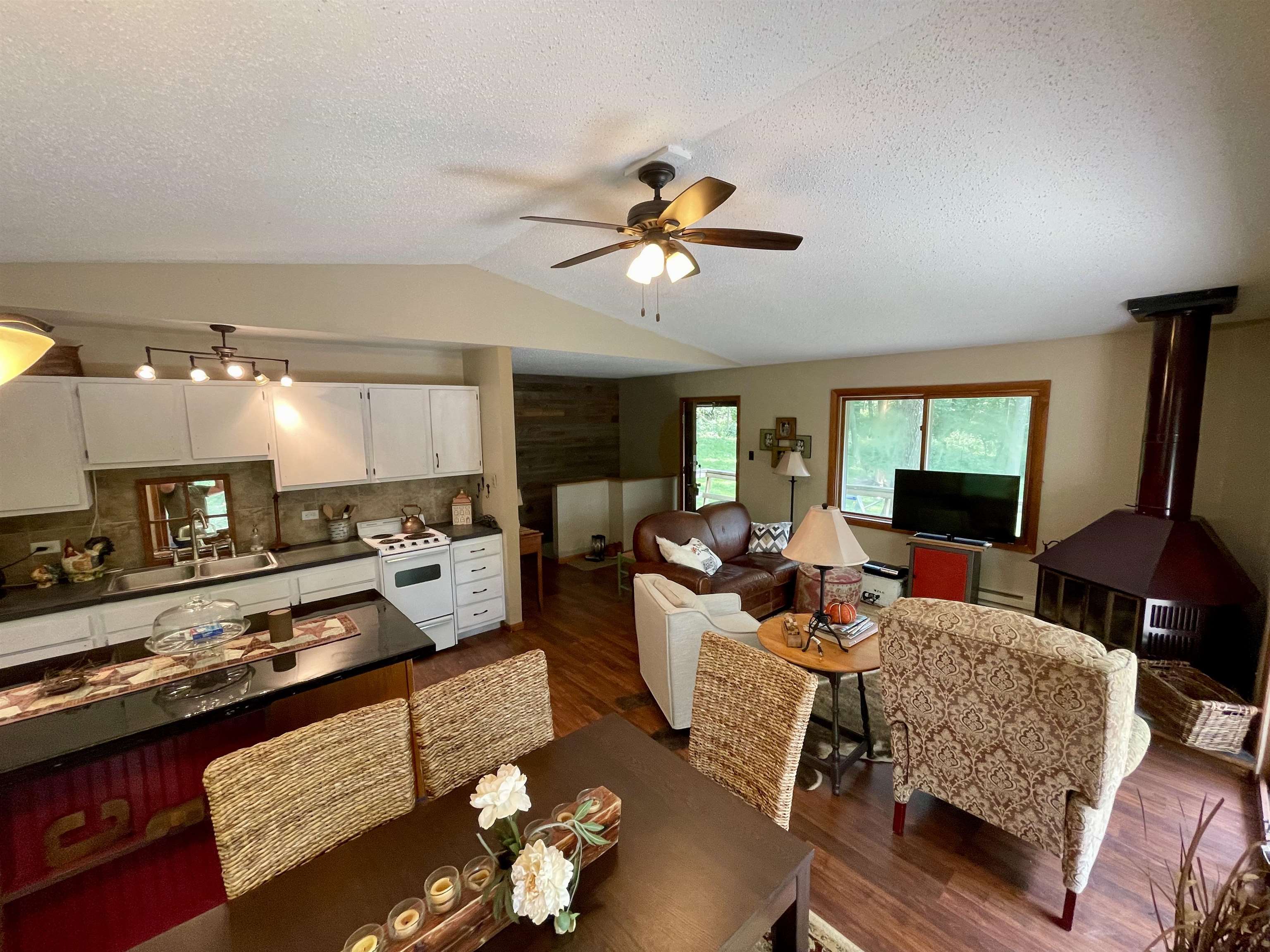 8008 West Blanding Road Hanover, IL 61041 - Photo 29 of 67 a living room with furniture fireplace and a window