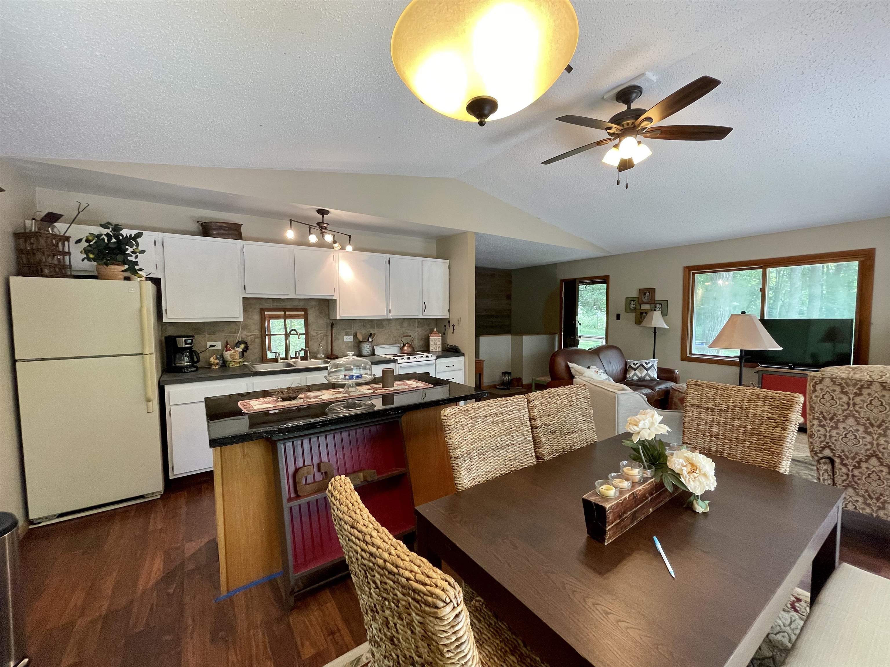 8008 West Blanding Road Hanover, IL 61041 - Photo 32 of 67 a living room with furniture kitchen view and a wooden floor