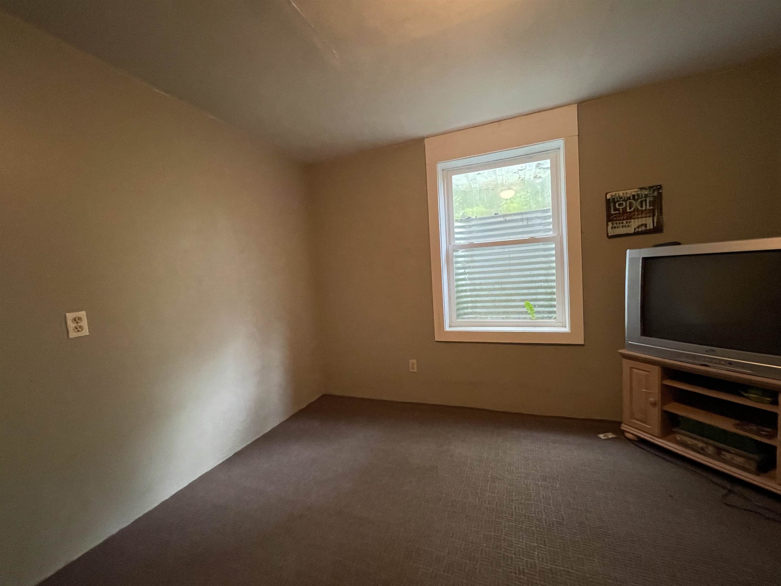 8008 West Blanding Road Hanover, IL 61041 - Photo 37 of 67 a view of an empty room with a window