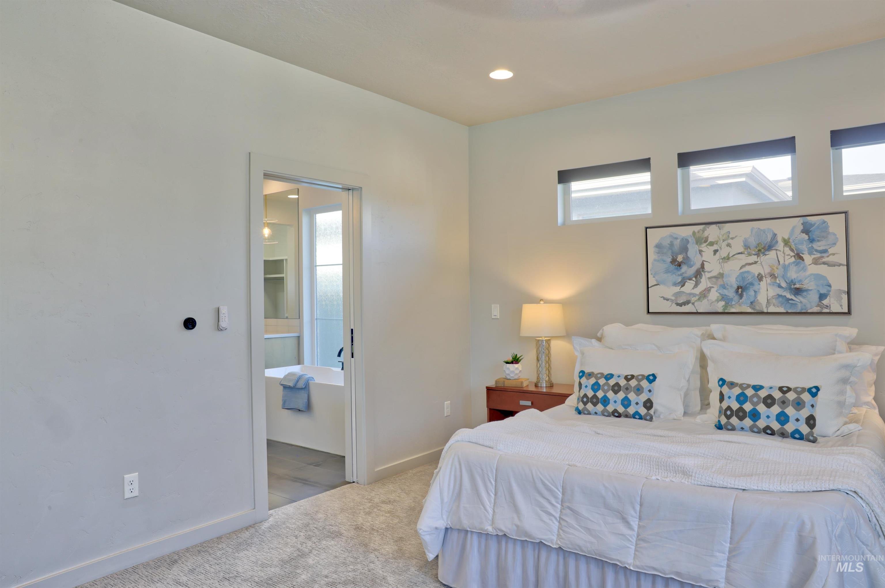 4148 East Copper Point Drive Meridian, ID 83642 - Photo 11 of 26 Carpeted bedroom featuring recessed lighting and ensuite bathroom