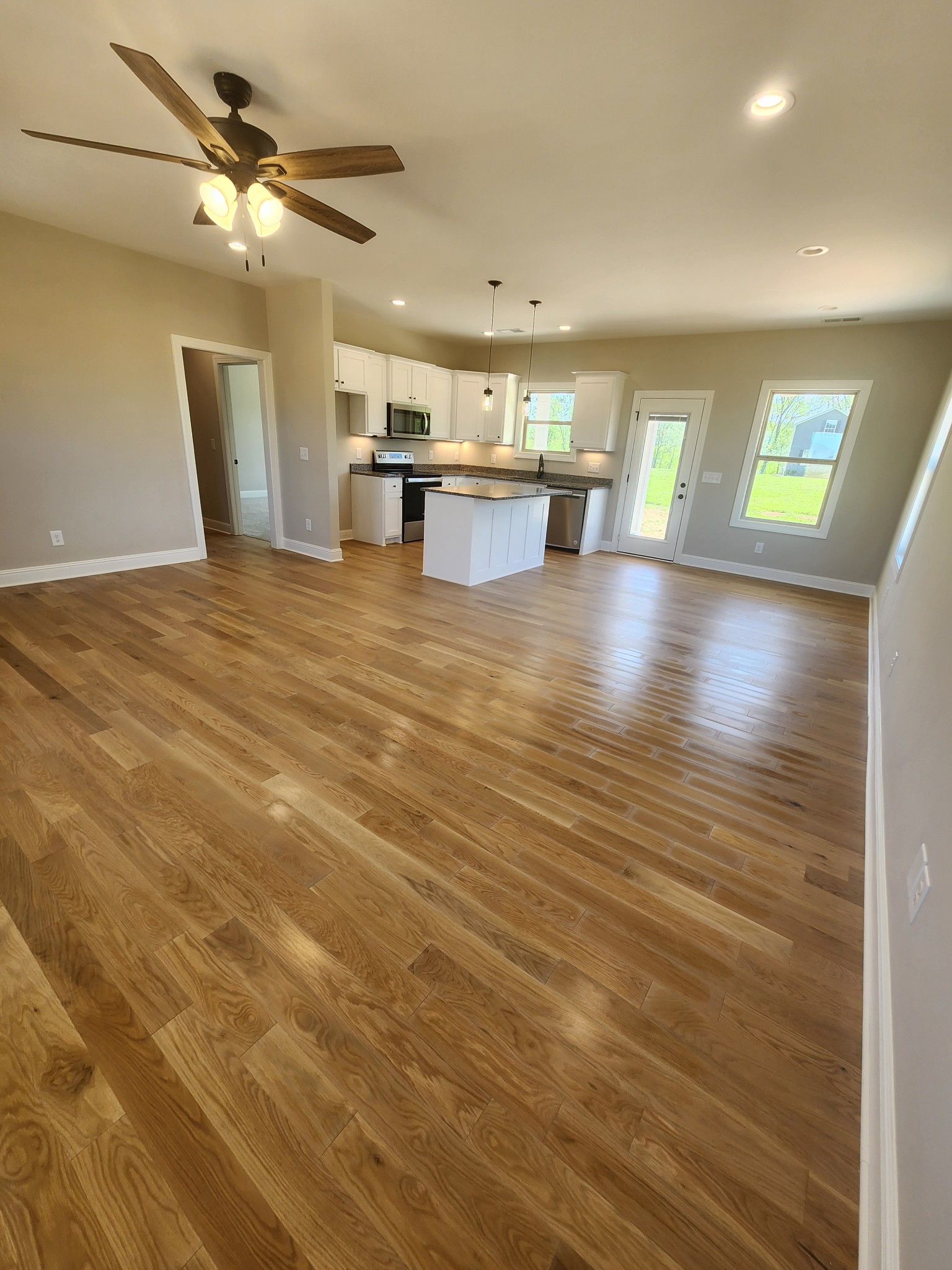 8963 Covington Road White House, TN 37188 - Photo 8 of 32 a view of kitchen and dining room with wooden floor