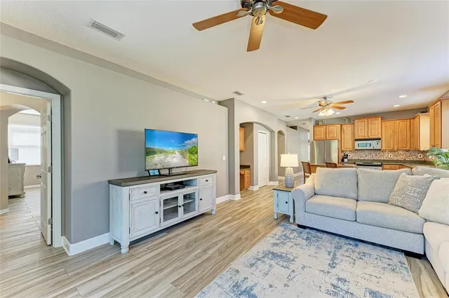 a living room with furniture and a large window