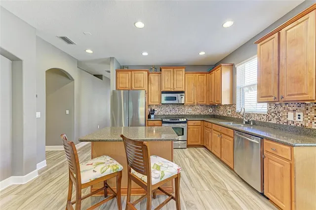 a workspace with furniture and wooden floor