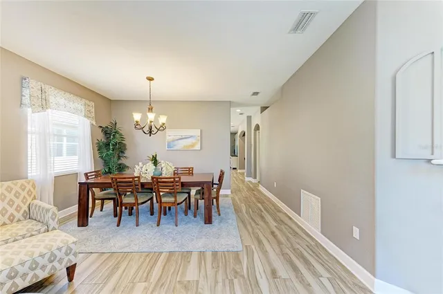 a bathroom with a tub shower and sink