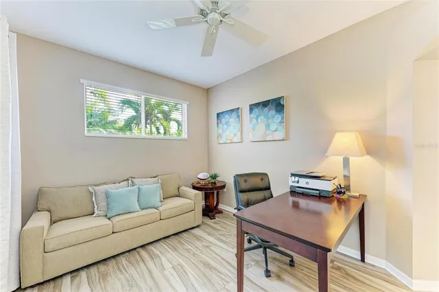 a bathroom with a granite countertop sink a mirror a vanity and shower