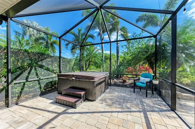a swimming pool with outdoor seating and yard