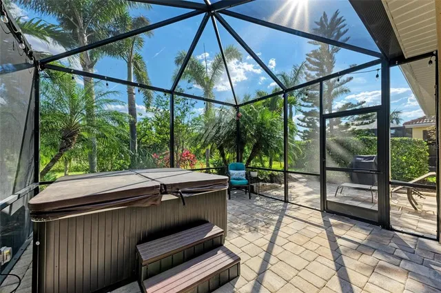 a living room with fireplace furniture and a large window