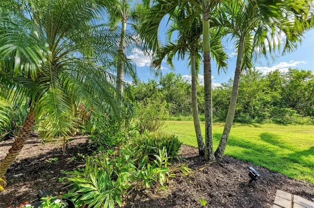 an aerial view of residential building with outdoor space and lake view