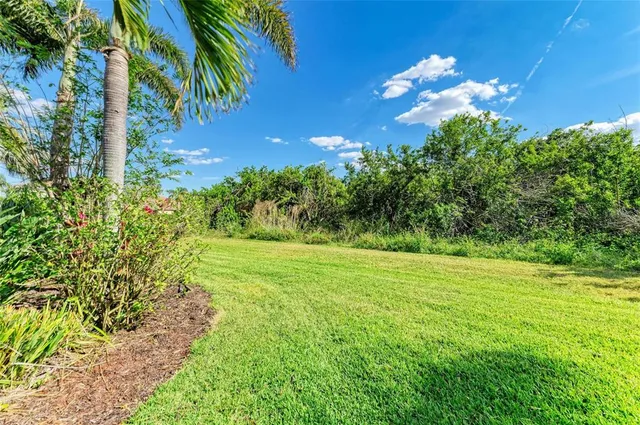 an aerial view of a house with a lake view