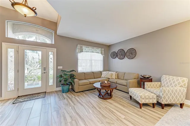 a living room with furniture and a table