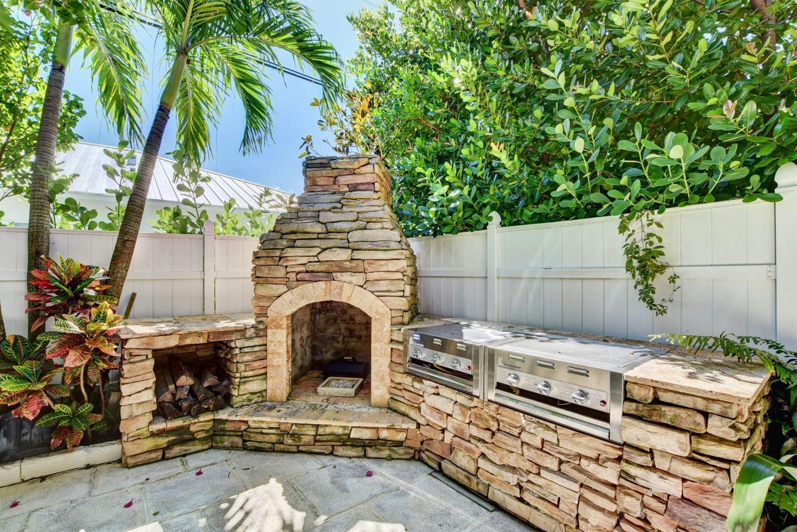224 Alpine Road West Palm Beach, FL 33405 - Photo 8 of 40 23_Summer Kitchen w Fire place