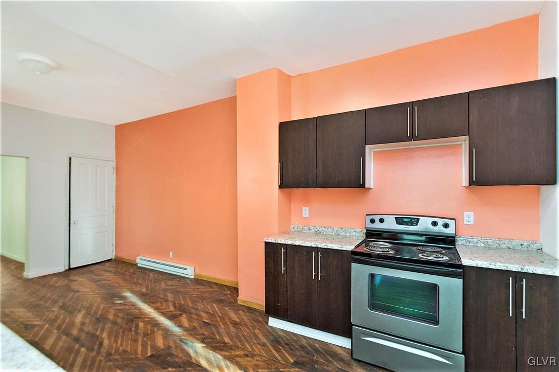 917 High Street Bethlehem, PA 18018 - Photo 12 of 25 a kitchen with a stove and a microwave